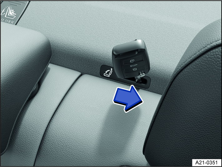 Fig. 60 Behind the rear seat backrest: mechanically unlocking the rear seat backrest using the emergency release.