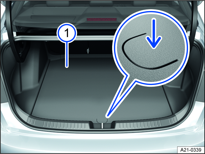Fig. 132 In the luggage compartment: opening the luggage compartment floor.