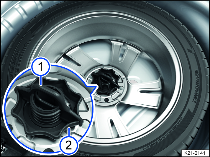 Fig. 203 In the luggage compartment: handle to secure the compact spare wheel.