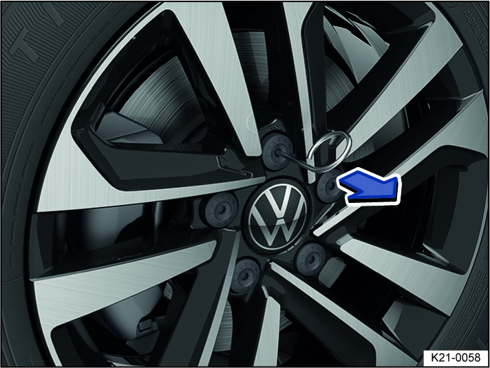 Fig. 200 Remove the caps from the wheel bolts.